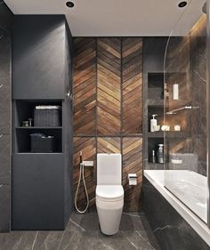 a modern bathroom with wood paneling on the walls and floor, along with a white toilet