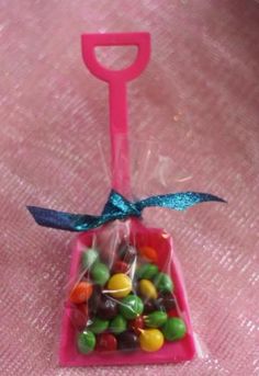 a pink plastic bag filled with lots of candy