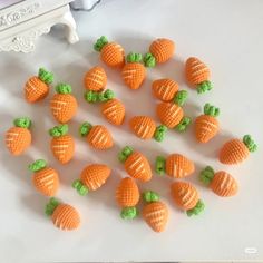 there are many small orange candies on the table