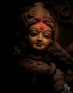 the face of a buddha statue is shown in this photo, with an artistic look on its face