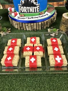 some food that is on top of a glass tray and in front of a sign