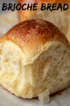 a close up of bread on a table with the words brioche bread written above it