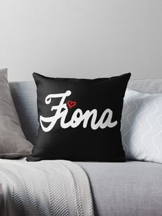 a black and white throw pillow with the word fono in cursive font