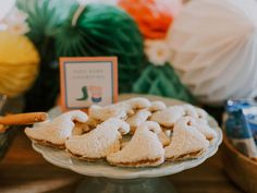 some cookies are on a plate near other items