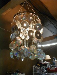 a chandelier with cds hanging from it