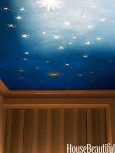 a blue ceiling with white stars painted on it