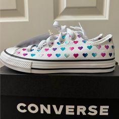 Super Cute Girls Size 2 White Converse Sneakers With Different Colored Hearts. My Daughter Did Not Use These Because They Run Big For A Little Girls Size 2. It’s Almost Like A Size 3 B It The Box And Actual Shoe Says 2. Anyway, These Are Brand New, The Box Is Included And Is In A Smoke Free Home. These Were Never Used Outside And Only Used To Try On In The House. Converse Shoes Girls, White Converse Sneakers, Converse For Kids, Hot Pink Cute Baby Converse, Converse Shoes Toddler, Toddler Converse, Girls Converse, Converse White, Kids Converse