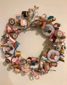 a wreath made out of various sewing items