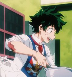 a young man with black hair and glasses is cooking