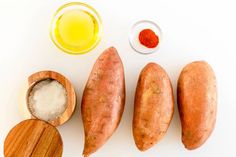 sweet potatoes, salt and seasoning on a white surface