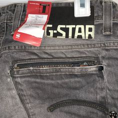 This Is For A New Pair Of G-Star Raw Straight Fit Jeans. The Color Is A Medium Washed Dark Gray Color. The Tags Say Black Denim. The Pockets Are Unusual. On The Back There’s Two Regular Pockets. On The Right Side Pocket There Is An Additional Zipper Pocket That’s Located Inside The Back Pocket Which Is Hidden From Sight. There Are 3 Front Pockets. Actual Measurements Are 34” Waist By 29” Inseam. Item Is Free From Stains Odors And Defects. Item Is Stored In My Non-Smoking Dog Free Home. Z 14 Jeans G Star, G Star Jeans, Dark Gray Color, Dark Grey Color, Straight Fit Jeans, G Star Raw, Side Pocket, Right Side, Black Denim