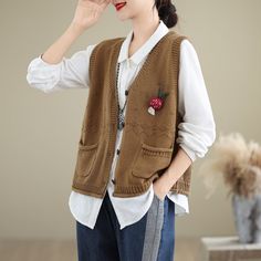 Details: Item: Autumn V-neck Pockets Cotton Knitted Vests Fabric: Cotton Collar: V-Neck Pattern: Solid Color Color: Beige, Khaki, Caramel, Green, Coffee, Black Style: Classic, Loose Size Bust Length Shoulder cm inch cm inch cm inch One Size 108 42.52 54 21.26 38 14.96 Brown V-neck Cardigan For Layering, Casual Brown Knit V-neck Sweater, Casual Brown V-neck Sweater For Work, Brown Knitted V-neck Sweater, Brown Knitted V-neck Top, Casual Brown V-neck Sweater For Layering, Casual Brown Knitted Sweater Vest, Fall Casual V-neck Sweater Vest, Casual V-neck Sweater Vest For Fall