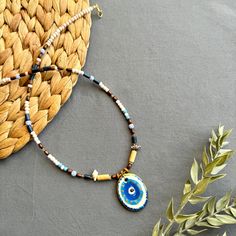 🌟 Designed for those who like to be original and looking for unique jewelry  ✅ Each piece is hand-shaped and drawn by us, making it wonderfully unique--so, expect a bit of delightful variation from the pictures 🍀 Because of their handmade charm, every ceramic piece is entirely one-of-a-kind. These high-quality creations are made to last, just like the memories you'll create with them!  🎁 It is suitable for every day , it can also be purchased as a perfect gift for special days like Valentine's Day, Mother's Day, Christmas or Birthday gift 🧿 Turkish evil eye  The evil eye symbolizes protection from bad energy and envy in Turkish and Middle Eastern culture The evil eye bead is believed to bring good vibes and good luck, we hope it will give you the same feeling! 📦 Packing :  All necklac Handmade Multicolor Necklace Souvenir, Unique Colorful Beaded Jewelry As A Gift, Bohemian Beaded Necklace With Round Pendant As Gift, Handmade Amulet Beaded Necklace For Gift, Handmade Symbolic Jewelry, Handmade Artistic Beaded Necklaces, Artistic Handmade Beaded Necklaces With Round Beads, Beaded Amulet Necklace As Gift, Amulet Style Beaded Necklace Gift