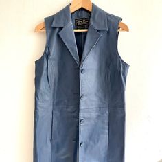 Amazing Vintage Leather Vest By Jerry Lewis. This Is A Maxi Length Duster Style Vest That Is Very Fun To Style. Perfect Over Dresses Or Wide Leg Pants. - Navy Blue Leather - Buttons All The Way Down Front - Fully Lined - In Excellent Condition W/ No Flaws - Tagged Size Xsmall But Measures Like A Small/Medium - B: 18” W:18” L:40” Vintage Leather Vest, Sleeveless Duster, Jerry Lewis, Style Vest, Maxi Styles, Leather Vest, Vintage Jacket, Blue Leather, Vintage Leather