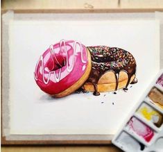 a painting of two doughnuts with chocolate and sprinkles on them