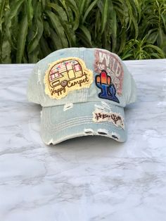 Happy Camper cap hat. This hat is made of 100% cotton. It is sun faded denim.  This hat has an embroidered patch on front. It has a happy camper patch and a wild free patch. I hand painted a heart on the back of the hat.  🧢This 6 panel hat has an adjustable strap meaning this one size fits most. This hat has a vintage distressed washed style, soft and lightweight. Unisex hat.  💦CARE: Hand wash only, do not use machine and air dry only.  I do not accept returns or exchanges, but if you have an Trucker Hat With Patch, Patch Hats Diy, Hats With Patches, Patches On Hats, Camper Hat, Hats Ideas, Trucker Hat Fashion, Hat Burning, Patch Bag