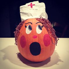 a pumpkin with a nurse's hat on it