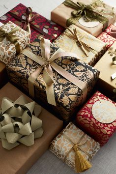 several wrapped presents are sitting on the table