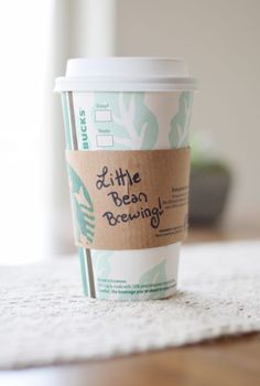 a coffee cup sitting on top of a table