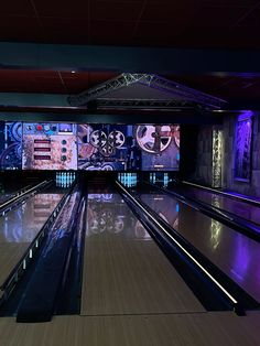 a bowling alley with several lanes and lights