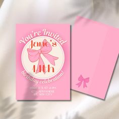 a pink birthday card with a bow on the front and back of it, featuring an image of a woman's birth