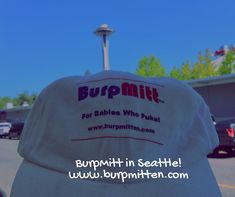 a white hat with the words burpmilt on it sitting in front of a parking lot