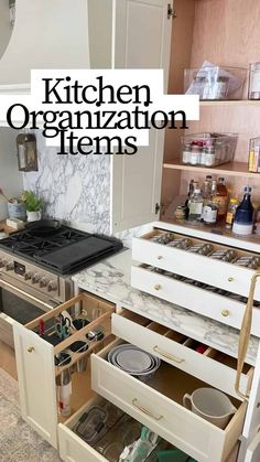 the kitchen organization items are organized in an open drawer on the countertop and under the stove