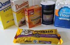 an assortment of breakfast foods including milk, cereal, and doughnuts on a counter