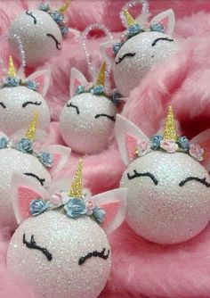 some white balls with unicorn faces on them