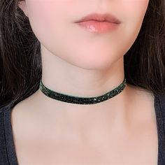 "A dark green choker featuring thin glitter velvet ribbon and bronze adjustable clasp. The length shown in photos is 12\" and more options are available. Each size comes with an additional 2.5\" extender chain. For best fit, measure around the smallest part of your neck (close to center) and choose the next smallest size. If you would like a different length, send me a message and I can make that for you :) Ribbon clamps, lobster clasp and chain are antique bronze tone alloy. Jewelry Care Tips F Egirl Necklace, Glitter Choker, Fairycore Necklace, Green Choker, Gothic Choker, World Necklace, Goth Choker, Velvet Necklace, Velvet Choker Necklaces