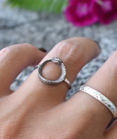 "Ouroboros Snake Circle Ring details: -Solid .925 sterling silver -Ourobors circle measures 12.5mm round, 1.5mm width band -Lightly oxidized -US sizes 6-8 Looking for a last minute or unique Christmas gift? Visit our \"READY TO SHIP\" section here, ships out in one business day https://www.etsy.com/shop/AWildViolet?section_id=23587515 Connect with us on Instagram @a_wild_violet for sales and giveaways! **All items are in stock and ship within 2-5 business days from received payment (excluding Sa Bohemian Adjustable Snake Jewelry, Adjustable Bohemian Snake Jewelry, Silver Snake-shaped Promise Ring, Unique Sterling Silver Snake Ring, Silver Snake Ring With Oxidized Finish, Silver Snake Ring With Oxidized Finish As Gift, Silver Snake Ring With Oxidized Finish For Gift, Spiritual Snake Ring As Gift, Unique Round Snake Ring Gift