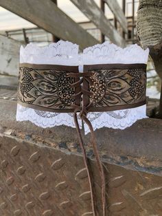 a pair of brown and white garters with lace