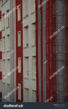 red and white buildings with scaffolding on them