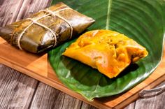 some food is sitting on a green leaf