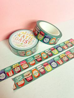 two rolls of washi tape sitting next to each other on top of a table