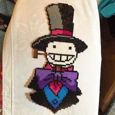 a white towel with an image of a man wearing a top hat