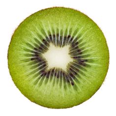 a kiwi cut in half on a white background