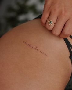 a woman with a tattoo on her back saying, i love you to the moon and back