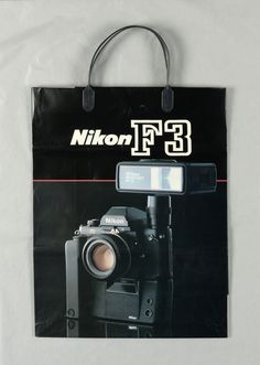 a black bag with a camera on it and the words nikon - t3