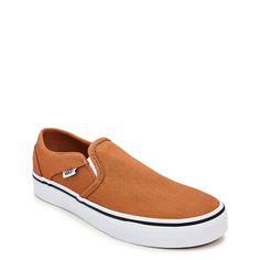 Top off your relaxed vibe with the laid-back styling of these women’s Vans Asher brown sugar sneakers. Made of canvas upper, these skateboard-inspired kicks have a round toe, slip-on design and dual gore elastic inserts for a snug fit and easy wearing. Features include a padded collar for comfort, vulcanized rubber midsole with sporty stripe detail, and a durable rubber outsole with waffle-patterned tread. Pair 'em up with your favorite jeans, chinos, and boardshorts. | Vans Women's Asher Slip-O Dress Sandals Flat, Native Shoes, Wide Width Shoes, Shoes Heels Pumps, Retro Sneakers, Kids Sandals, Wedge Sneakers, Chunky Sneakers, Vegan Shoes