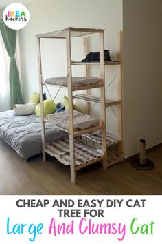 a cat sitting on top of a bed next to a wooden shelf filled with pillows