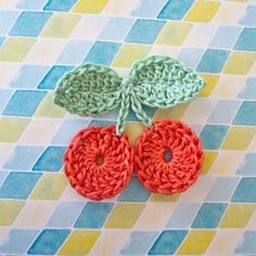 two crocheted leaves on top of each other