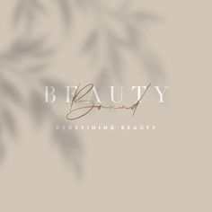 the word beauty is written in gold on a beige background with palm leaves and shadows