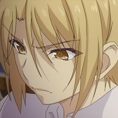 an anime character with blonde hair and brown eyes looks at the camera while staring into the distance