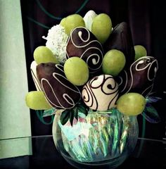 a vase filled with green and white candies