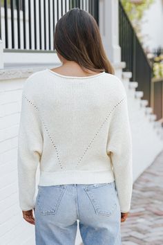 Expertly crafted from 100% polyester, this Cream Boat Neck Pointelle Sweater offers both comfort and style! Its unique design features a rolled collar and cuffs, long dolman sleeves, and a ribbed knit banded hem for a relaxed fit. Perfect for any occasion, it's a must-have addition to your wardrobe! Style with your favorite jeans or shorts along with some sneakers and simple gold jewelry for a casual chic everyday look. Trendy Cream Cropped Sweater For Spring, Casual Batwing Sleeve Knit Top For Spring, Winter Ribbed Knit Top For Day Out, Ribbed Long Sleeve Cropped Sweater For Spring, Cotton Batwing Sleeve Sweater For Fall, Fall Cotton Sweater With Batwing Sleeves, Trendy Relaxed Fit Cropped Sweater For Spring, Spring Textured Knit Cropped Sweater With Relaxed Fit, Spring Cropped Sweater With Textured Knit And Relaxed Fit