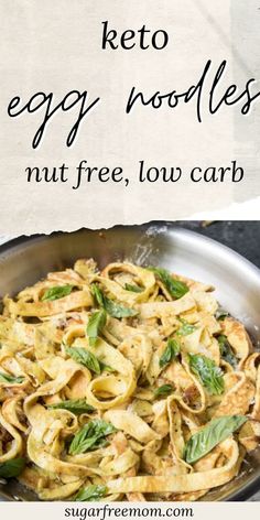 a skillet filled with egg noodles and spinach