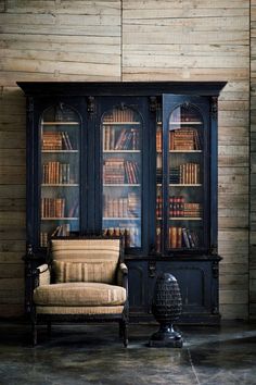 an old fashioned bookcase with books in it