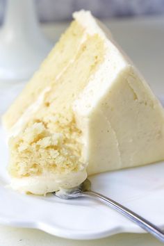 a piece of cake sitting on top of a white plate with a fork in it