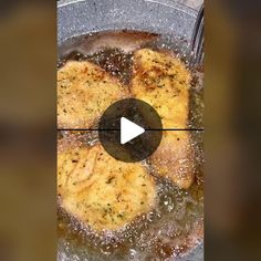 some food is being cooked in a pan with water and oil on the stove top